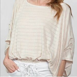 Free People Azalea Dolman
Cream Top Perforated stripes Elastic Waist Size L NWOT